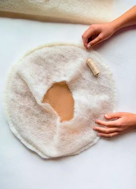 Sew cardboard into felt